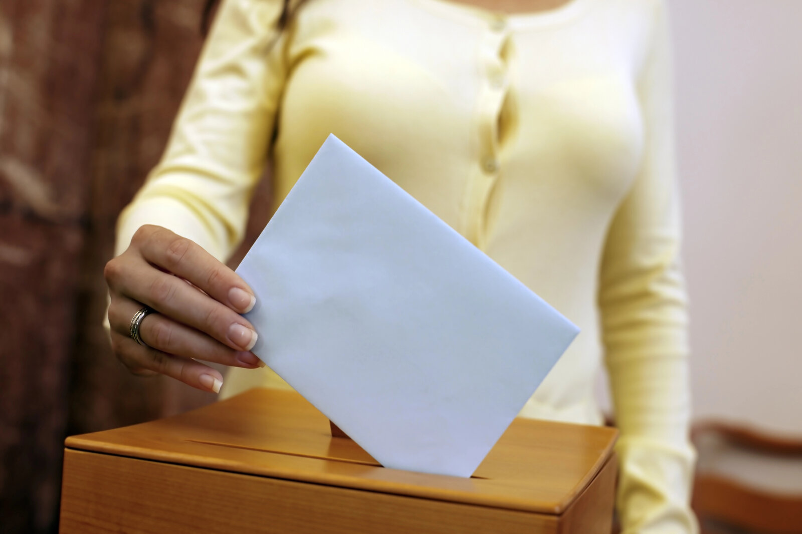 Voter casting a ballot at a local polling place
